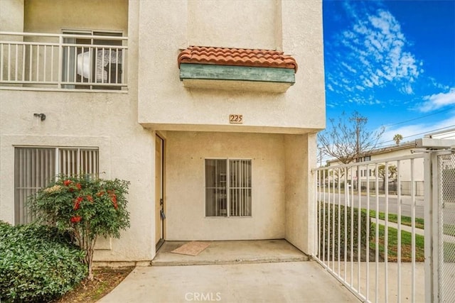 doorway to property with a patio area