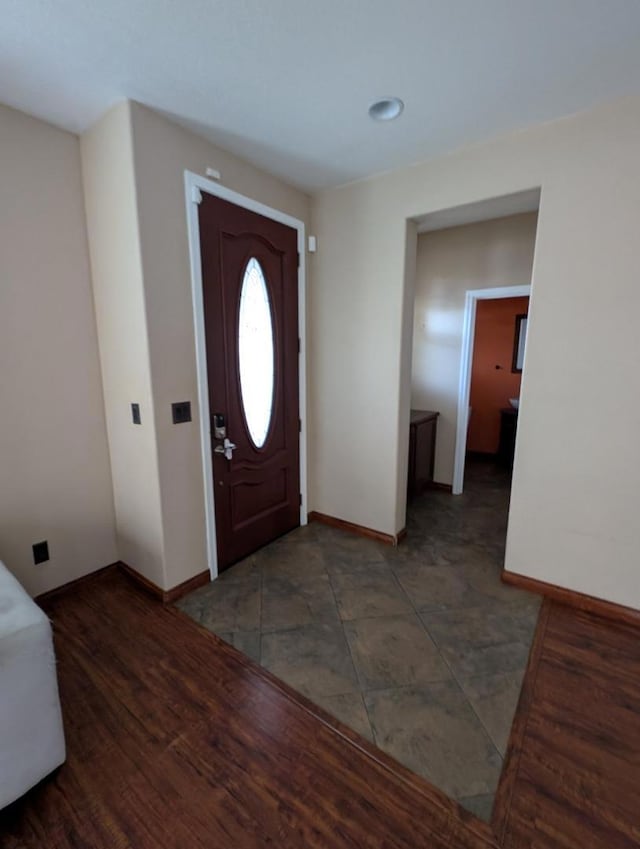 foyer with dark hardwood / wood-style flooring