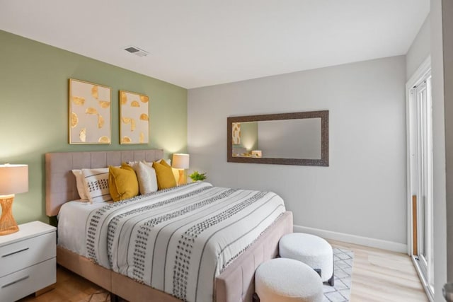 bedroom with light wood-type flooring