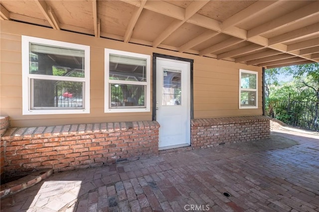 entrance to property featuring a patio area