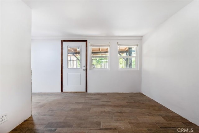 unfurnished room with dark hardwood / wood-style floors