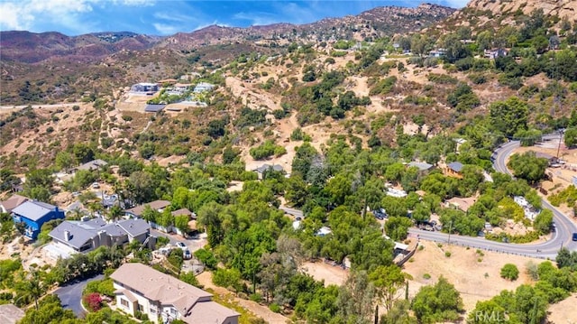 birds eye view of property featuring a mountain view