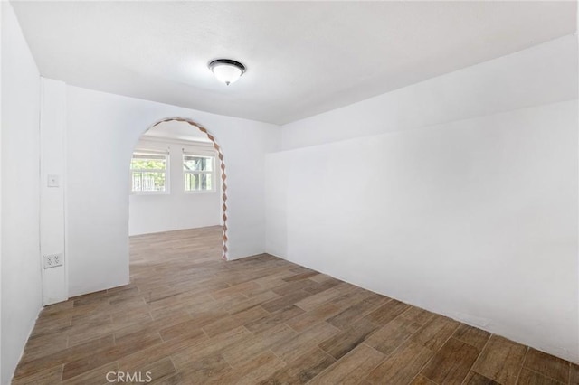 empty room featuring wood-type flooring