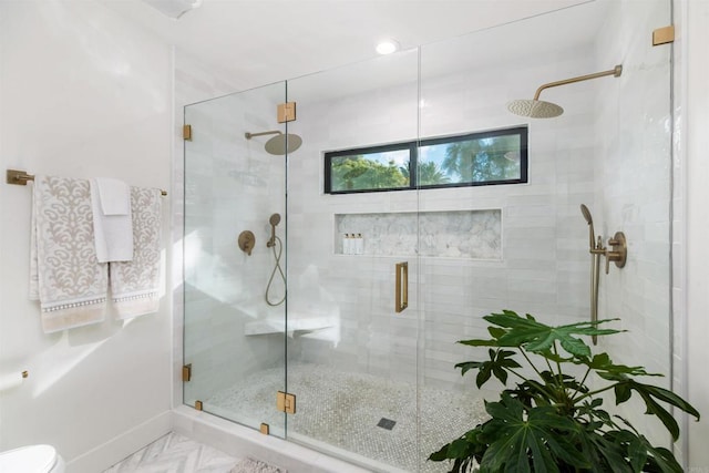 bathroom with a shower with shower door