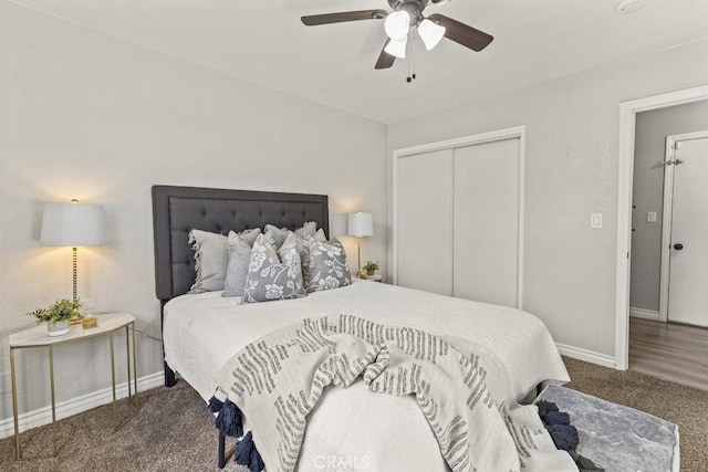 carpeted bedroom featuring ceiling fan and a closet