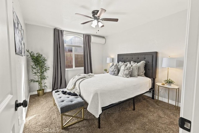 carpeted bedroom featuring ceiling fan and a wall mounted AC