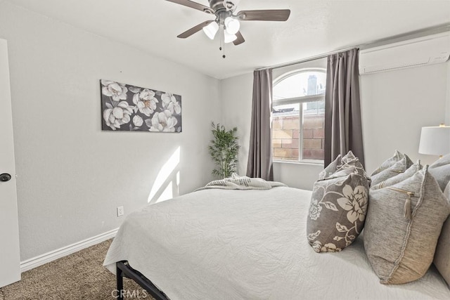 carpeted bedroom featuring ceiling fan and a wall mounted AC