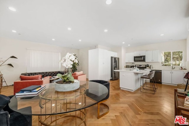 dining space featuring light parquet flooring