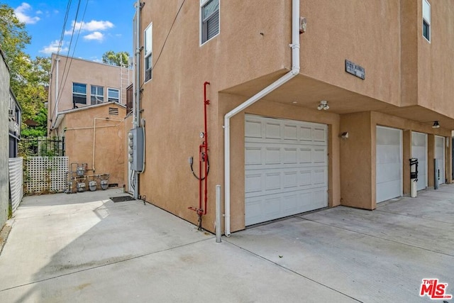 view of side of home with a garage