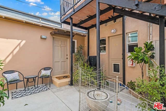 doorway to property with a patio area