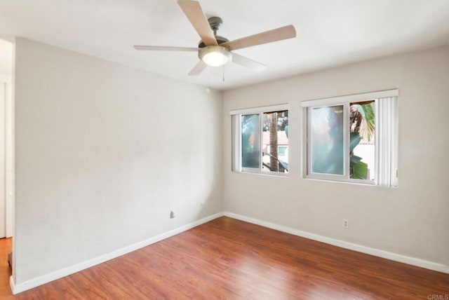 unfurnished room with wood-type flooring and ceiling fan