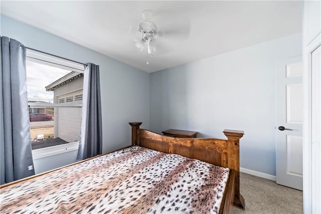 bedroom with light colored carpet and ceiling fan