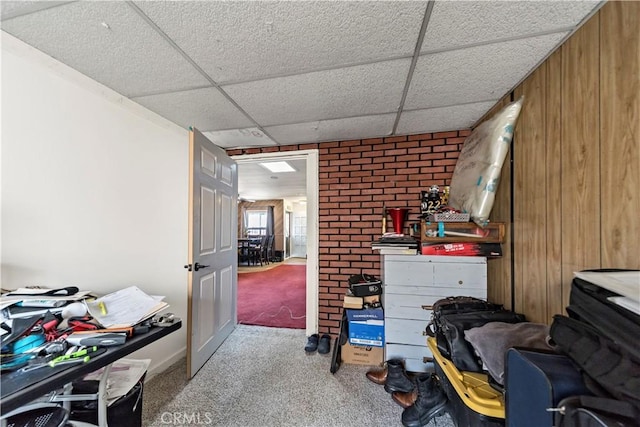 misc room with light carpet and a drop ceiling