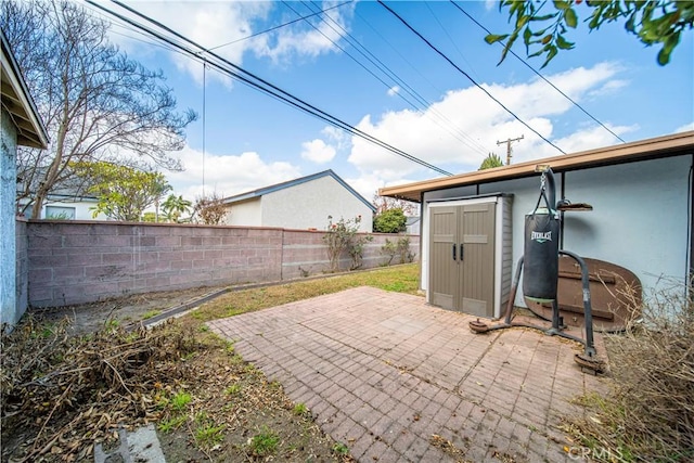 view of patio / terrace with a storage unit