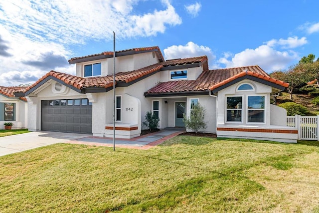 view of front of property featuring a garage and a front yard