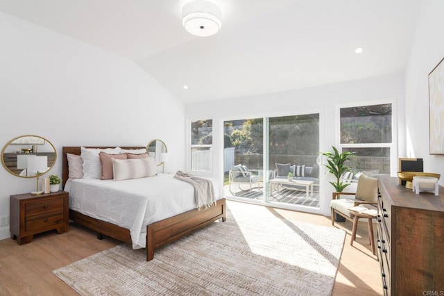 bedroom featuring access to exterior, vaulted ceiling, multiple windows, and light hardwood / wood-style flooring