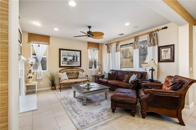 living room featuring light tile patterned flooring and ceiling fan