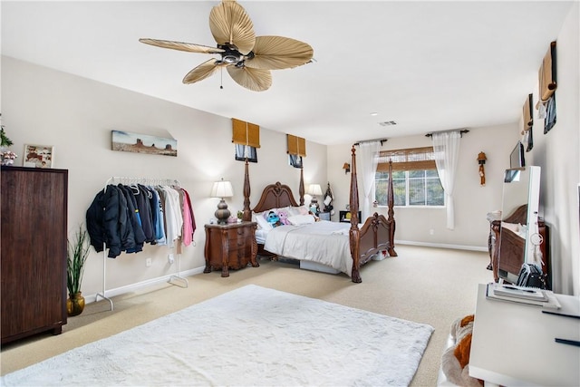 bedroom with light carpet and ceiling fan