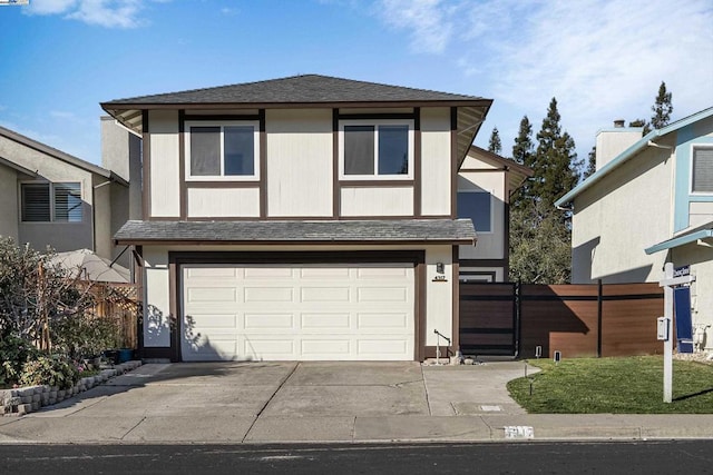 view of front of house with a garage and a front lawn