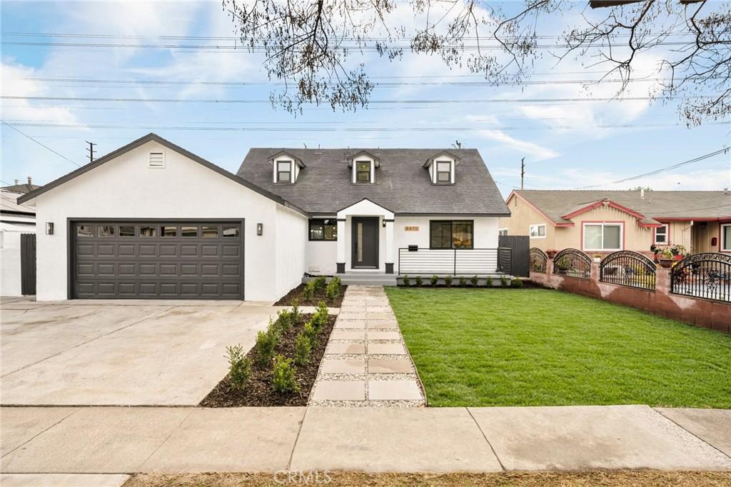 view of front of home with a garage and a front yard