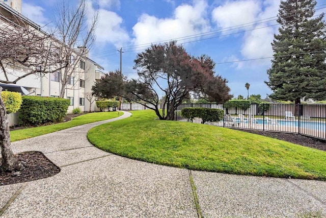 view of yard featuring a fenced in pool