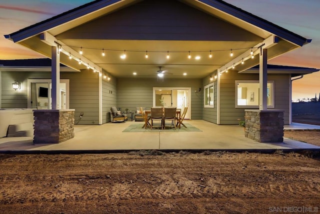 view of patio terrace at dusk