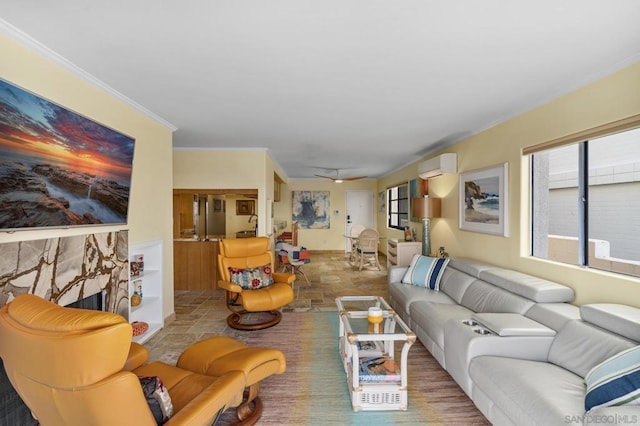 living room with ornamental molding, a fireplace, and a wall unit AC