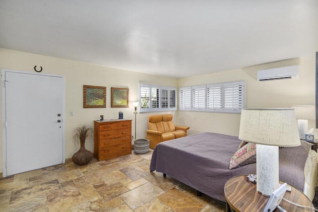 bedroom featuring a wall mounted air conditioner