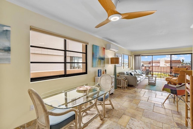 dining room with crown molding, a wall unit AC, and ceiling fan