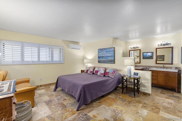 bedroom featuring sink and a wall mounted air conditioner