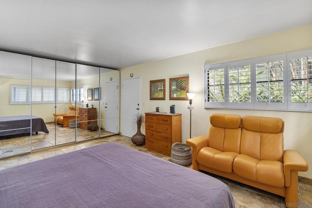 bedroom featuring multiple windows