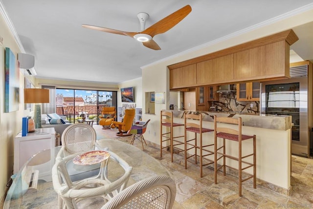 dining area featuring ornamental molding, a wall mounted air conditioner, and ceiling fan