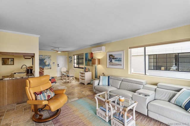 living room with sink, crown molding, a wall unit AC, and ceiling fan