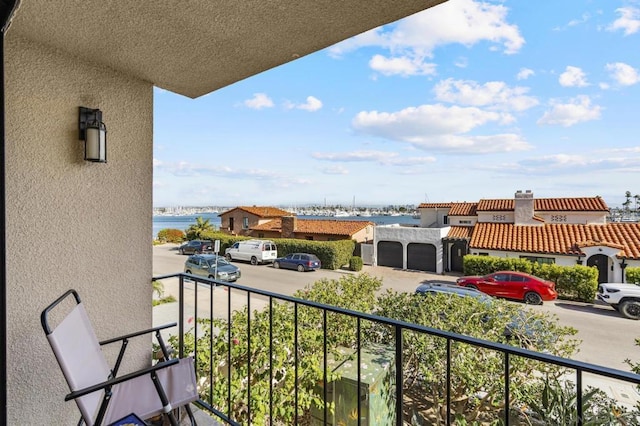 balcony featuring a water view