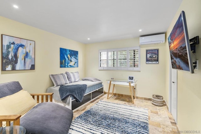 bedroom featuring a wall mounted AC