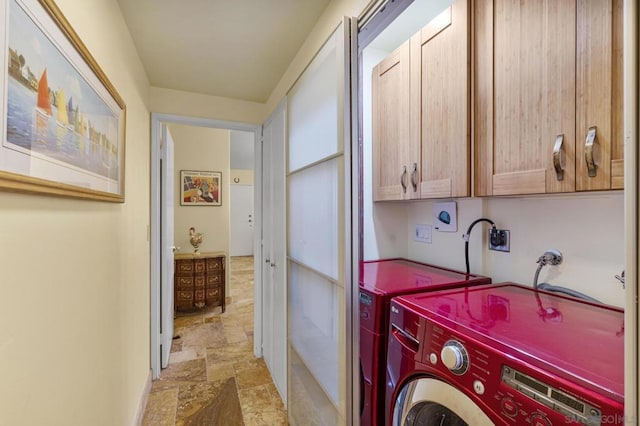 laundry area featuring cabinets and independent washer and dryer