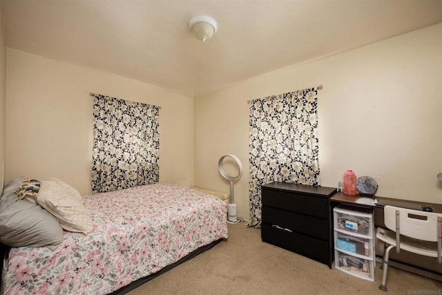 bedroom featuring light colored carpet