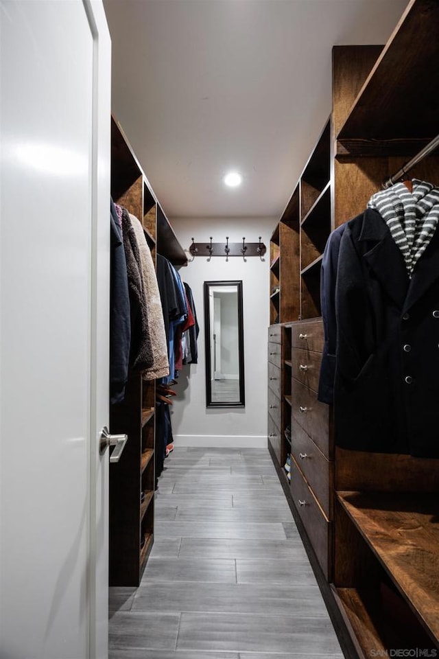 spacious closet featuring light hardwood / wood-style flooring