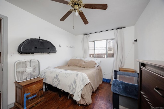 bedroom featuring ceiling fan and dark hardwood / wood-style floors