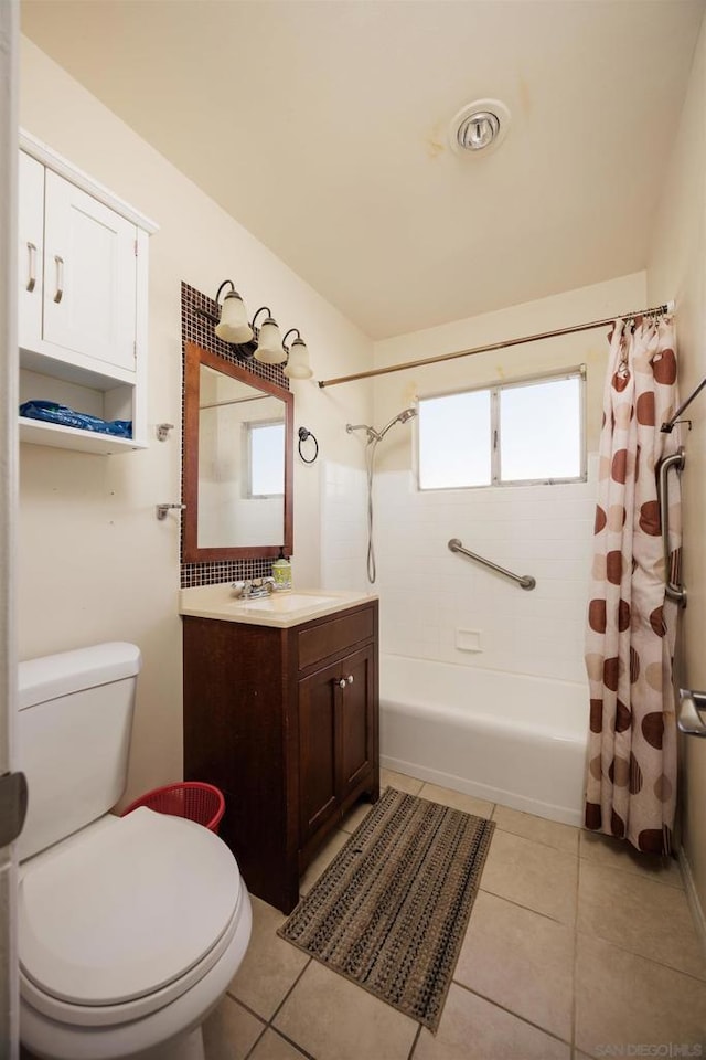 full bathroom with tile patterned flooring, vanity, shower / tub combo with curtain, and toilet