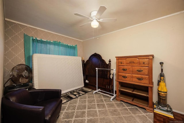 living area featuring hardwood / wood-style flooring, ceiling fan, and ornamental molding