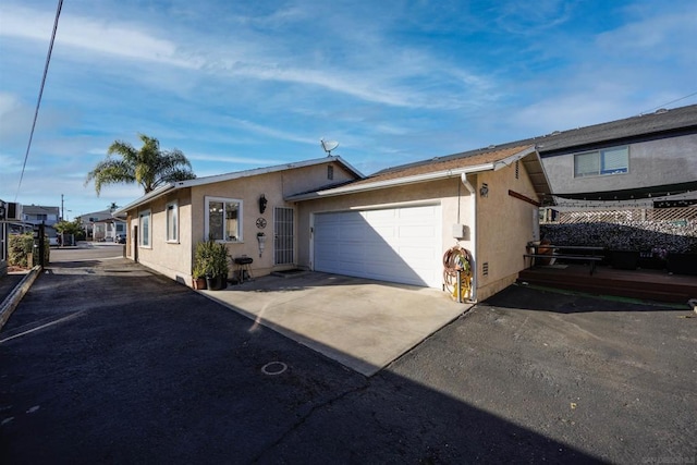 single story home featuring a garage