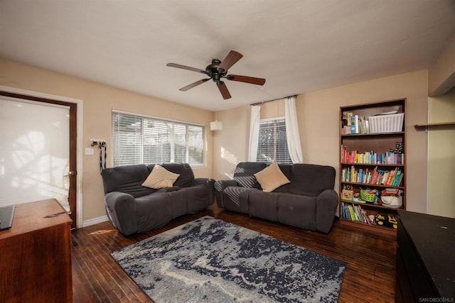 living room featuring dark hardwood / wood-style floors and ceiling fan