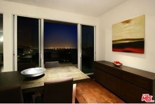 dining space with dark hardwood / wood-style flooring