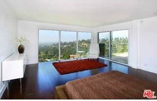 bedroom with dark hardwood / wood-style flooring and access to outside