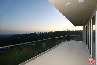 view of balcony at dusk