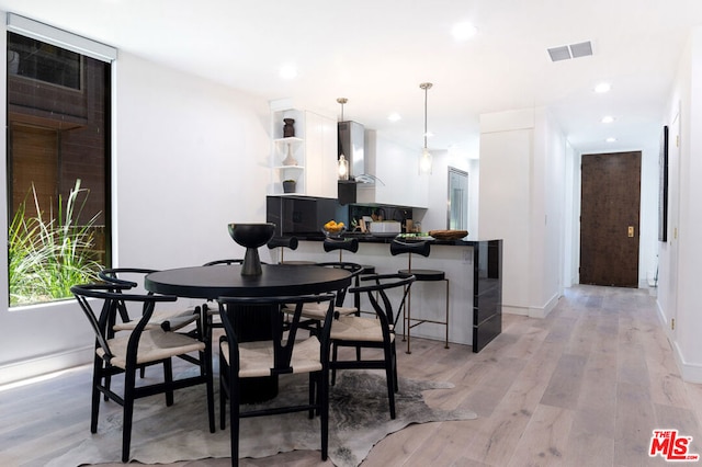 dining area featuring light hardwood / wood-style flooring