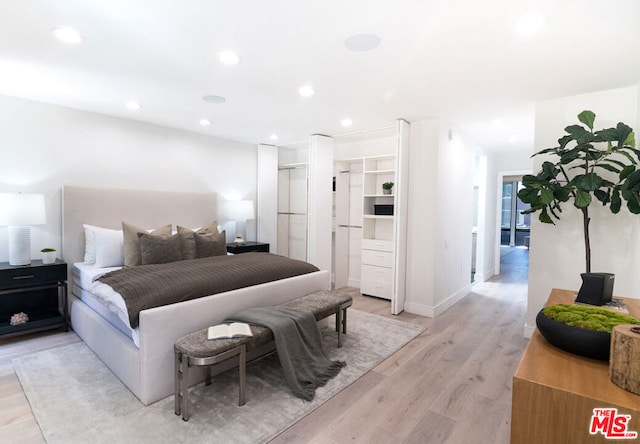 bedroom with light hardwood / wood-style flooring