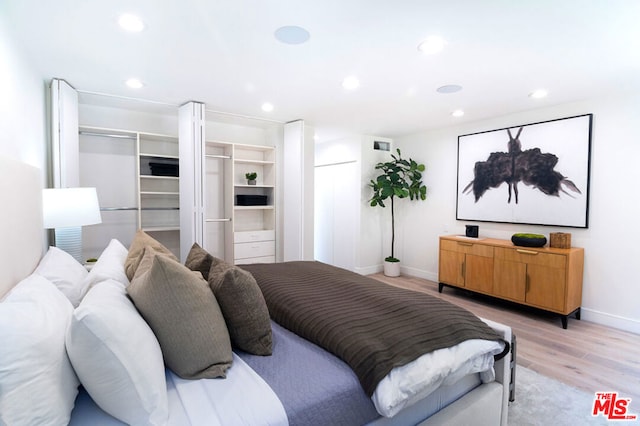 bedroom with light wood-type flooring