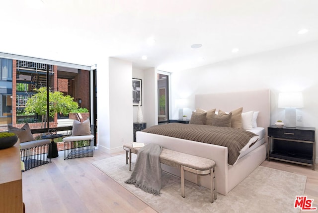 bedroom with light wood-type flooring